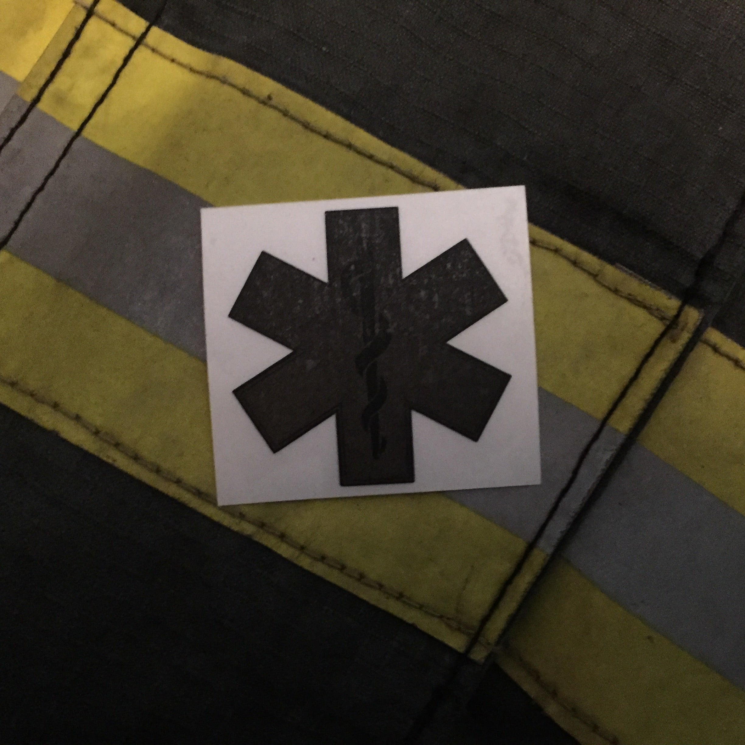 thumbnail image 2 of Subdued Reflective Star Of Life Fire Helmet Decal - Black Flag Style, 4 Inch (EMT) 2 of 3